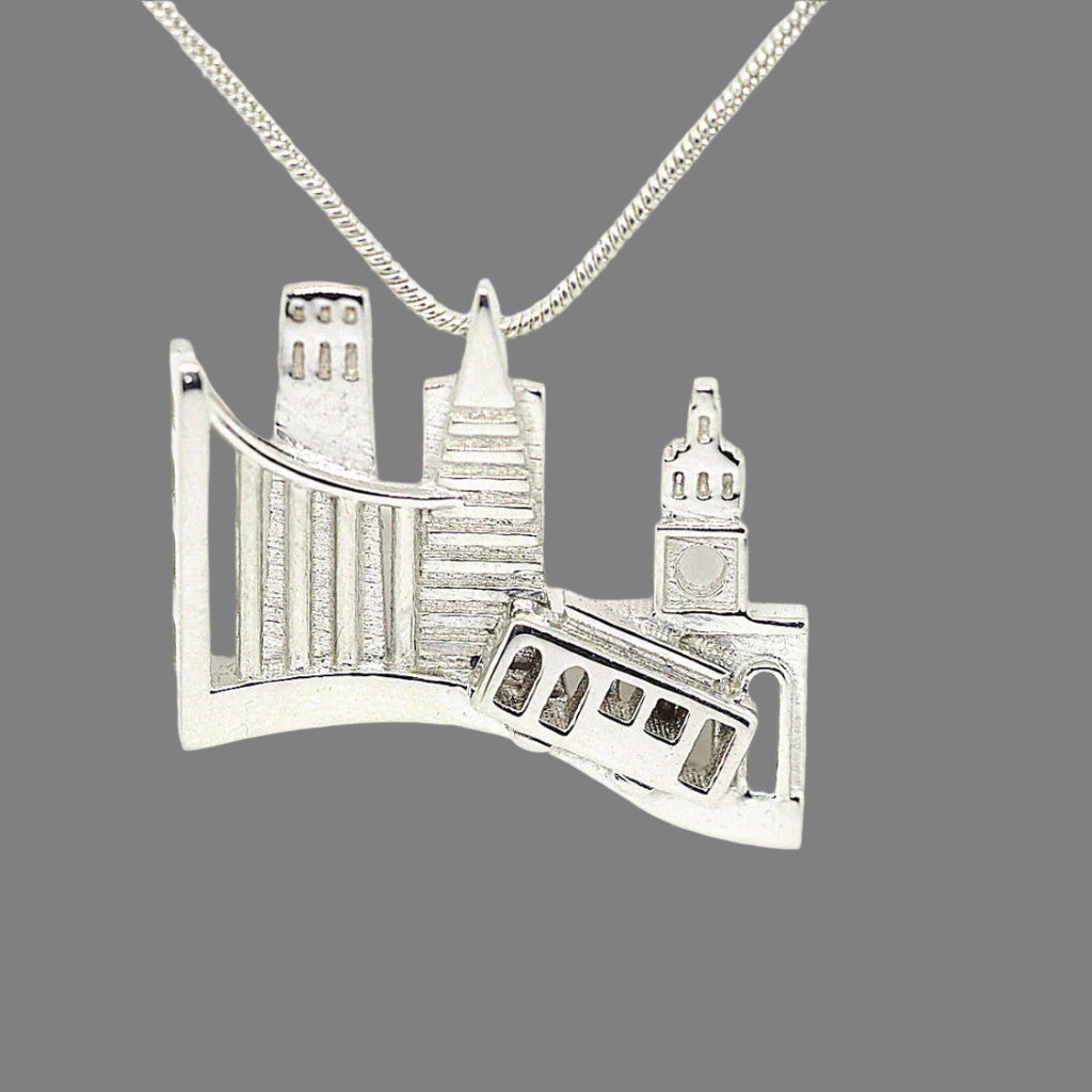 Silver pendant shaped like a bridge on a white background